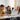 A group of students collaborating on a laptop in a modern classroom. Faronics Insight enhances digital learning by providing teachers with real-time classroom management, screen monitoring, and interactive tools to boost student engagement and focus.